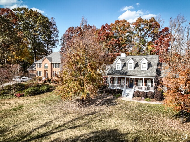 A row of mature homes in Mooresville.