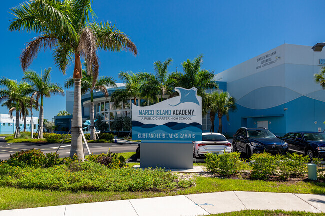 Marco Island Academy welcomes students with a large decorative sign.