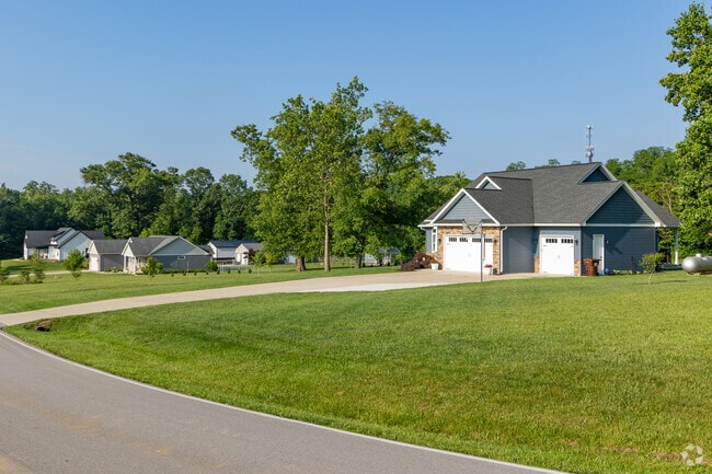 Some homes in Tecumseh have three car garages set on large lots.