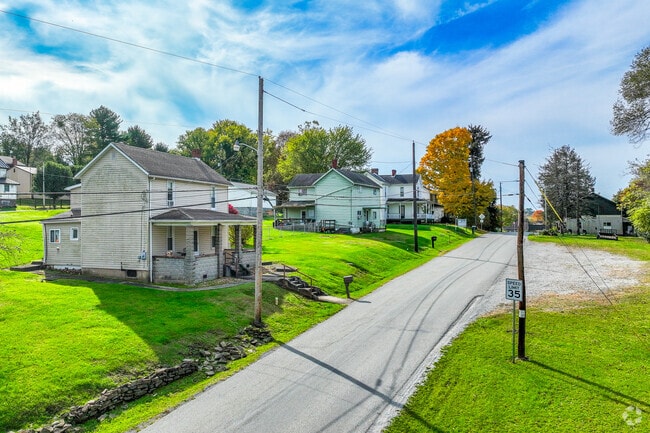 Grand two-story homes in Upper Tyrone Township sit on well-manicured lawns.