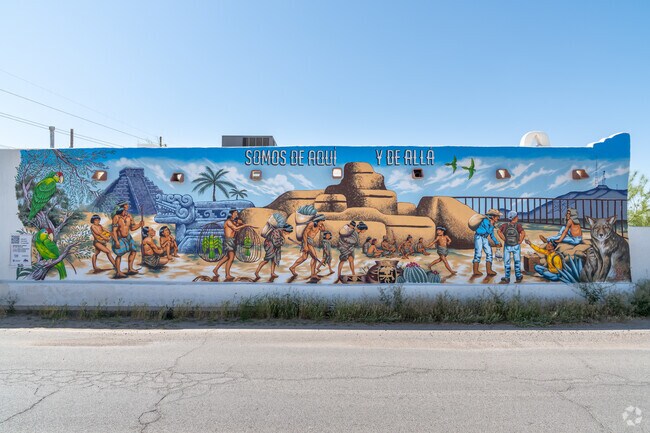 Discover Socorro's charm through Pablo Hernandez's vibrant mural masterpiece.