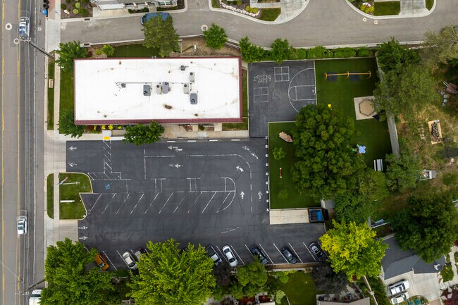 Aerial view of Challenger School show off its planned playground spread across a green lawn.