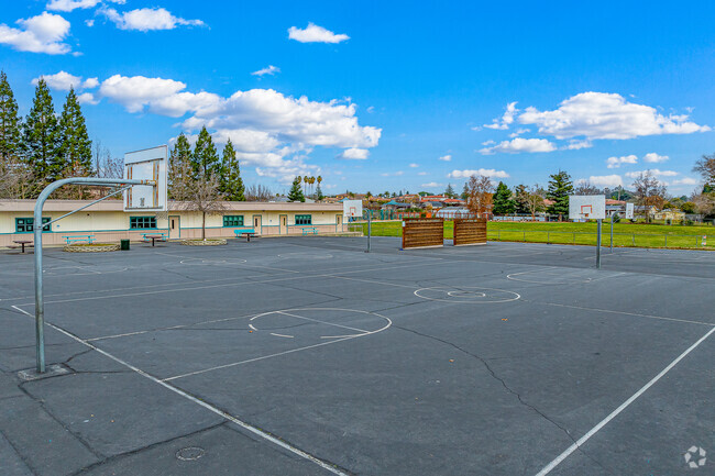 Kids practice basketball at recess for physical education at Ridgeview Elementary School.