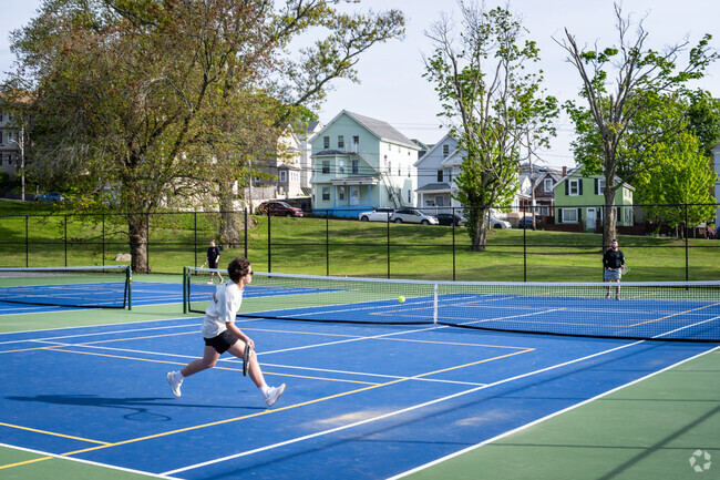 Gather your friends and play tennis at the court of Kennedy  Park Park, close to Saint Anne.