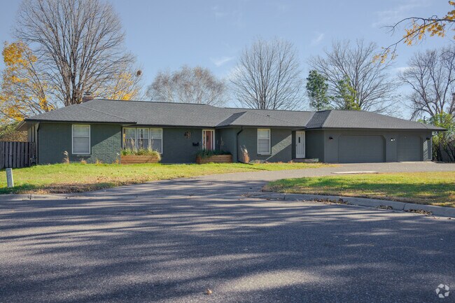 A ranch home sits back from the street in Twin Oaks.