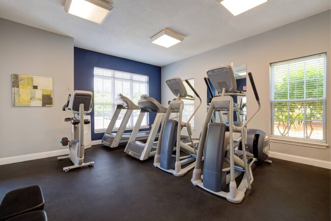 24/7 fitness center with two treadmills, two elliptical machines and stationary bicycle.