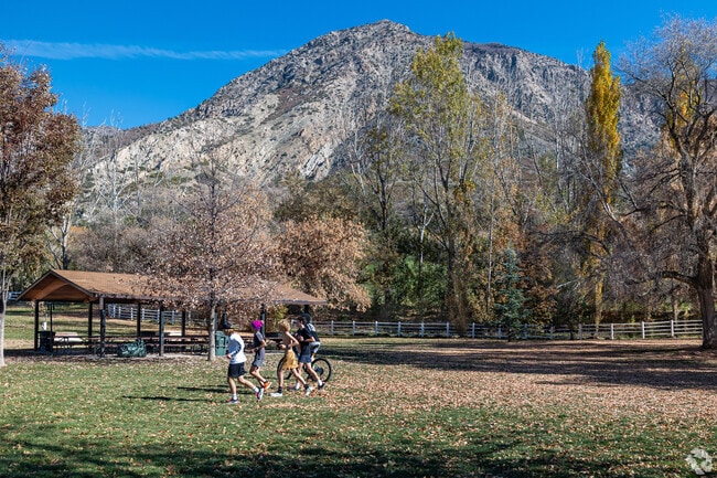 Youth jog at Mount Ogden Park on a fall day.