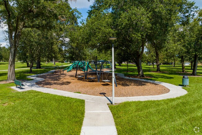 Let the kids run around at the large playground at Clear Lake Park nearby Park Central.