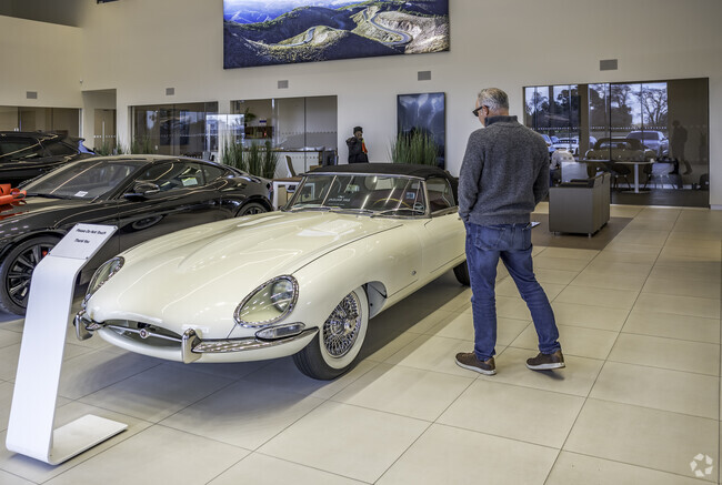 A gentleman is looking to purchase a new car at Land Rover Sacramento in Howe Edison.