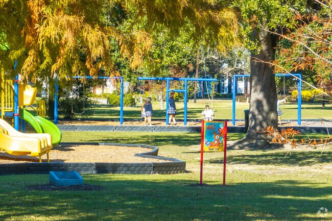 Families enjoy sunny days and scenic paths at Drew Park.