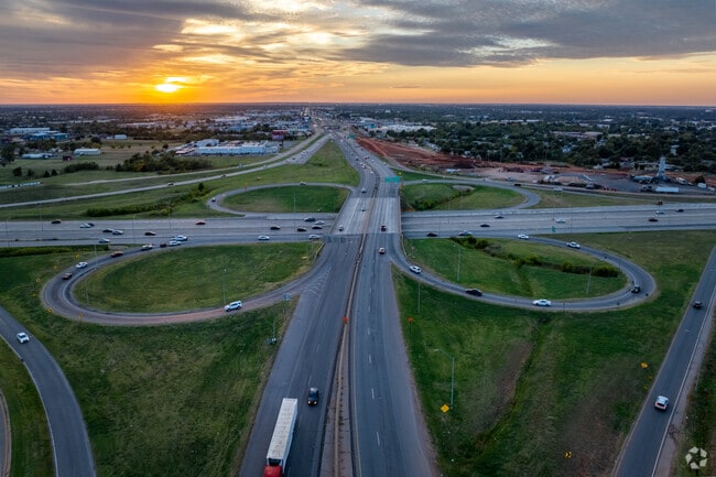 The concrete cloverleaf nearby Cloverleaf neighborhood helps residents get around the area.
