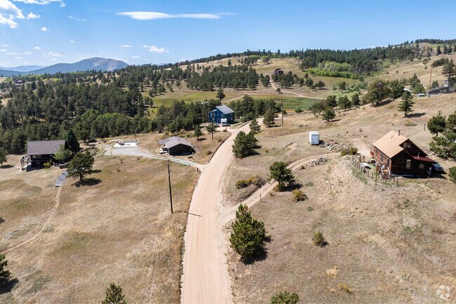 Farther out from the center of Gold Hill the winding dirt roads lead to larger modern homes.