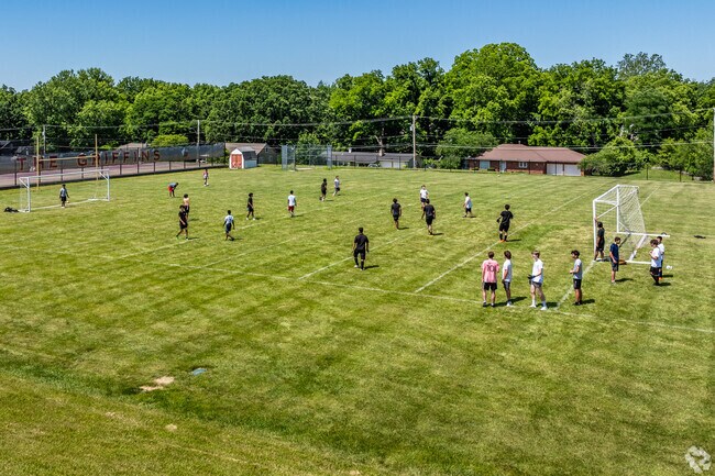 Students gather on the fields at Maple Park Middle School, where a strong sense of community and active outdoor programs complement the school’s focus on learning and growth.