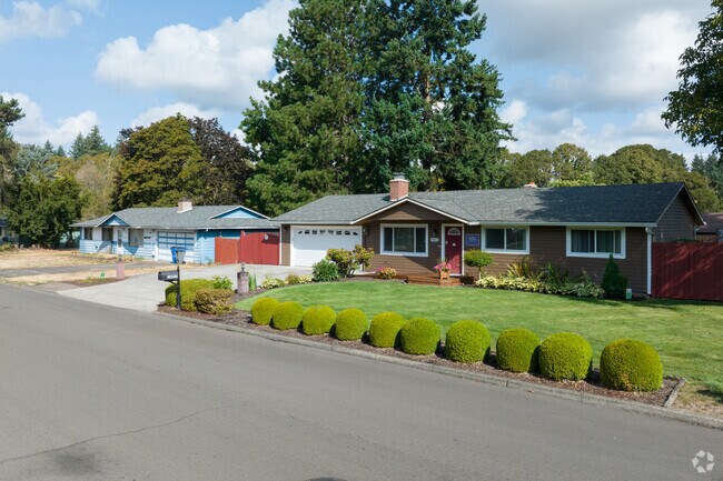 Manicured shrubs add curb appeal to classic ranch homes in Kevanna Park.