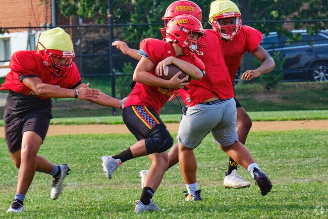 Locals enjoy football practice and outdoor sports in Connecticut Avenue Park’s green spaces.