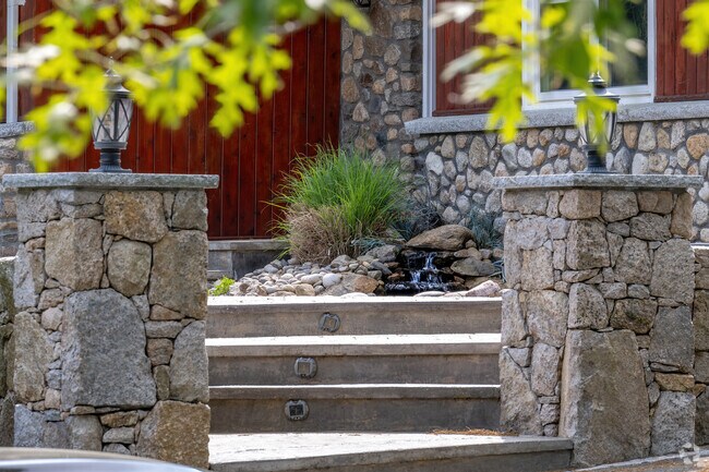 The waterfall at the front of a home in Nichols Corner exemplifies community pride.