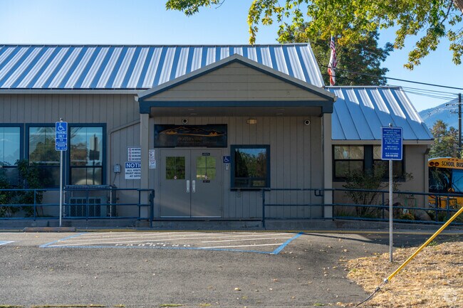The entrance to Butteville Elementary includes accessible ramps and glass double doors.