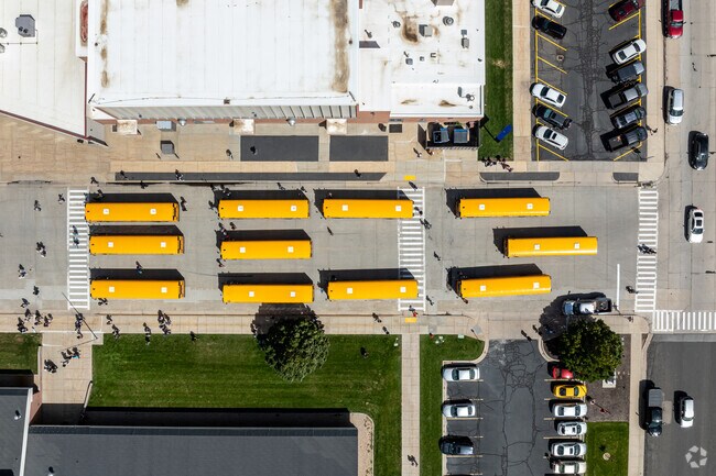 Students flock to school buses at North Summit High School.