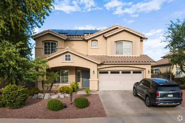 Homes in the Sun Groves neighborhood can feature desert landscaping and tall shade trees.