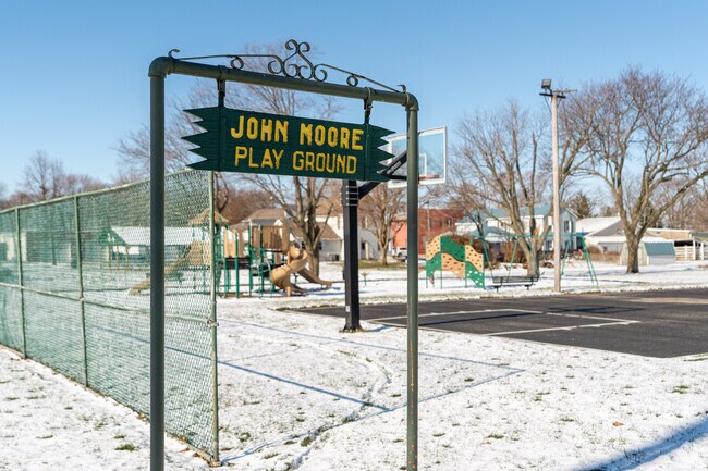 The playground and open play area at John Moore Play Ground is a favorite for kids in Lisbon.