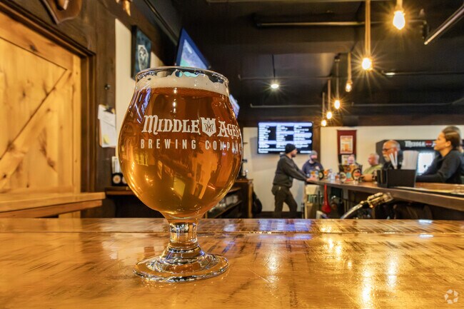 Middle Ages Brewing Company has 24 beers on tap and hosts trivia nights.
