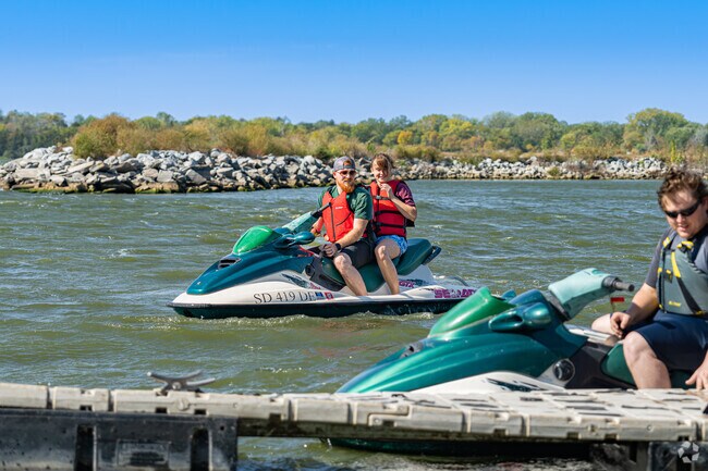An Oak Hills couple wait for their buddy to get ready at the Pawnee State Recreation Area.