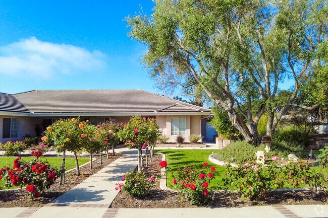 Manicured lawns bloom in Mission Hills.