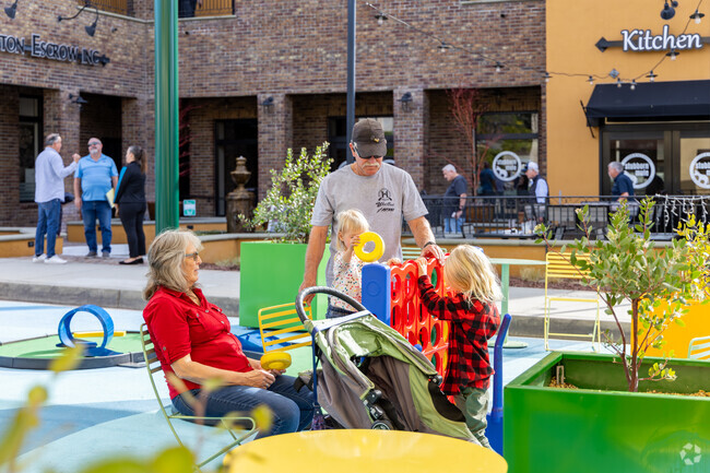 A family enjoys playing games together in Glendora, making memories in the sun.