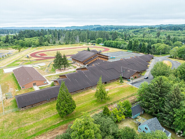 Miller Junior High School has a large campus with a football field and grassy fields.