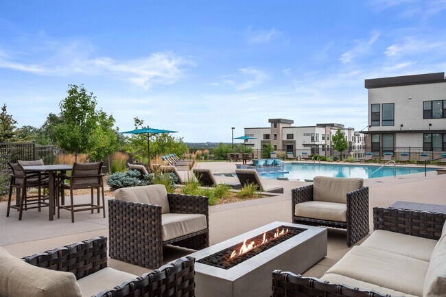 Outdoor Lounge with Fire Pit and Comfortable Seating Areas
