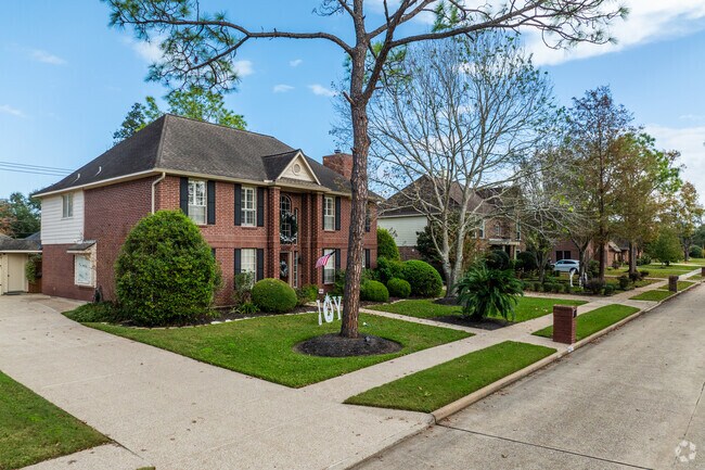 A row of two story homes sit along a quiet street in Falcon Ridge in Friendswood.
