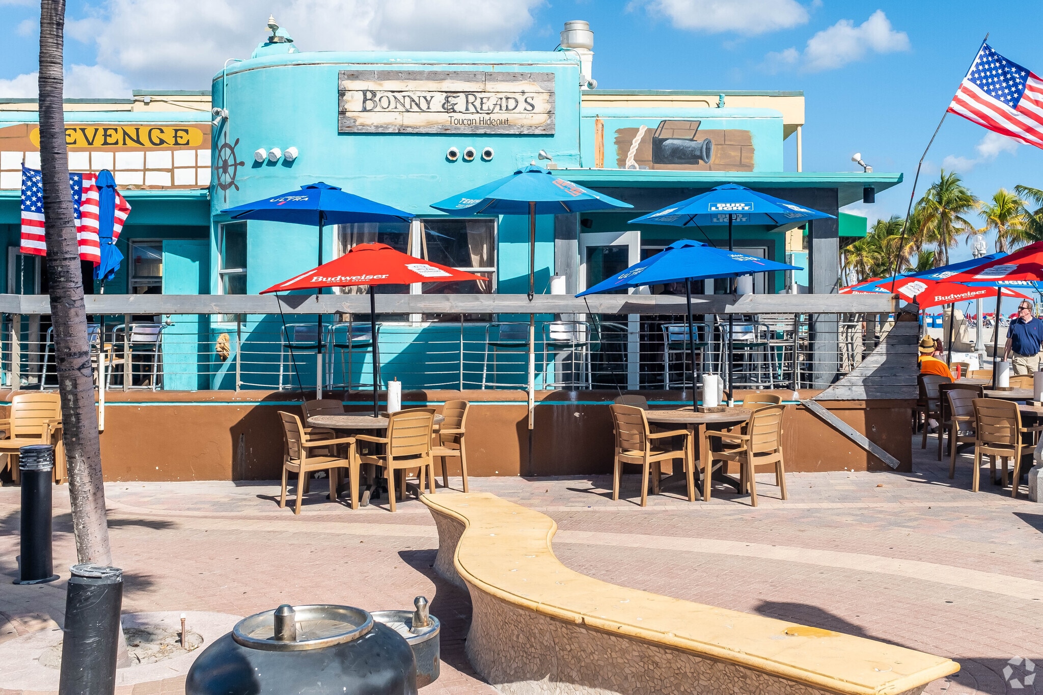 Outdoor dining area at Bonny & Read's Toucan Hideout in Hollywood Beach.