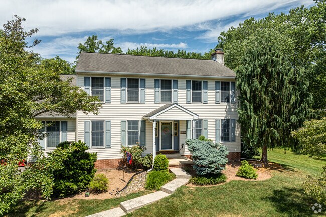 A large colonial home is kept well-maintained in a semi-rural part of North Coventry.