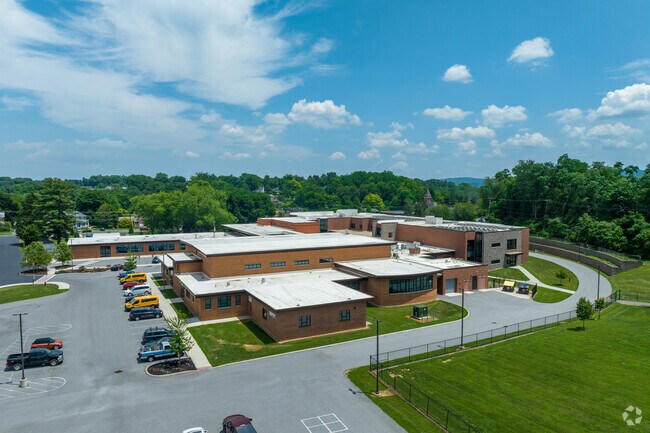 An aerial view over the main building for Iron Forge Elementary School.