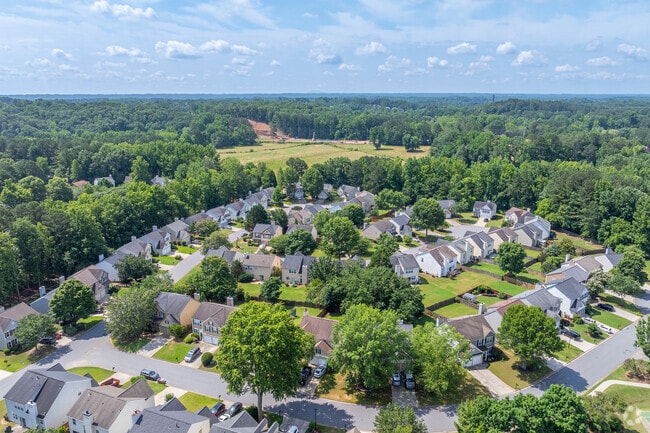 This expansive view highlights Wellington's blend of suburban comfort and natural surroundings, with homes nestled amid green landscapes.