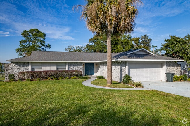 A beautiful stone faced ranch-style waterfront home on Bear Lake.
