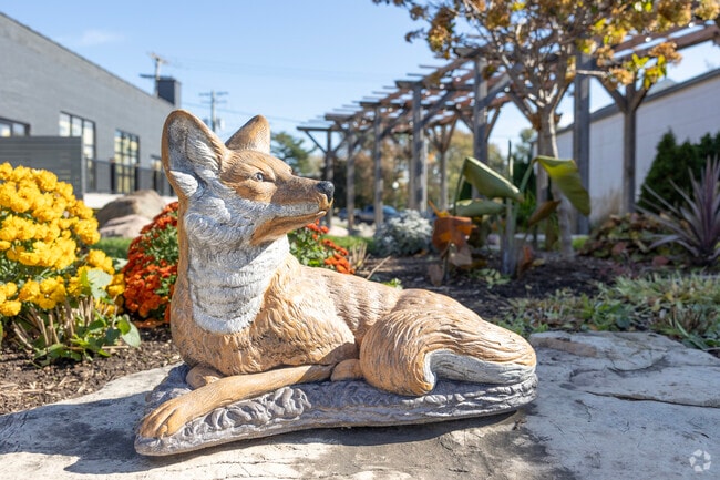 Statues honoring the sly Fox River as it runs through the heart of Lakeland Park.