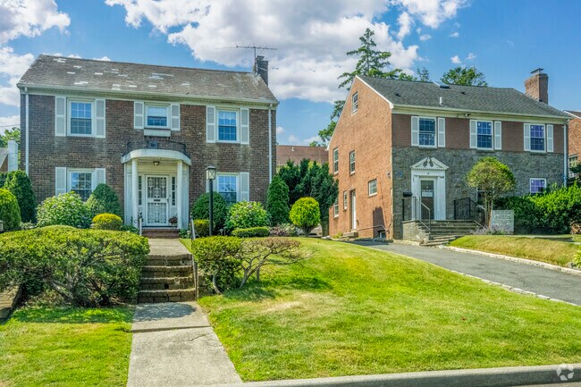 Colonial style homes in University Gardens-Russell Gardens often feature expansive yards.