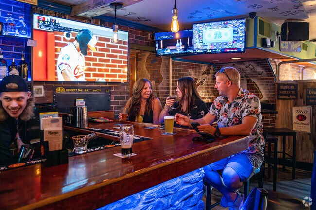 Friends meet up for happy hour for cocktails and snacks at The Market Street Inn near Eden.
