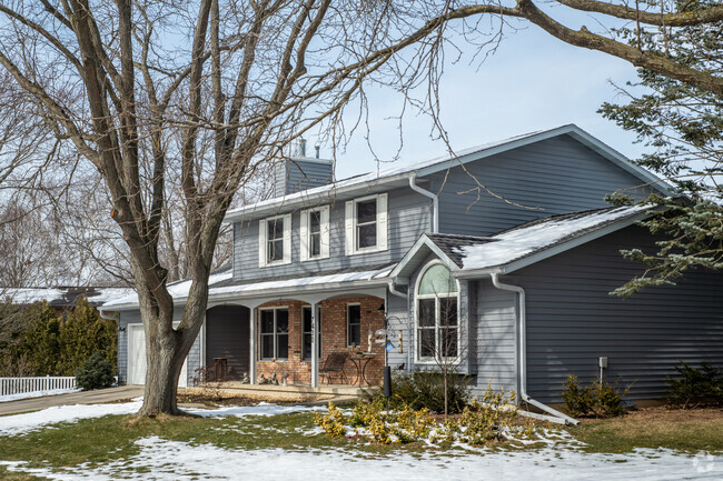 A Two-story Cape Cod-style house sits in Fox Ridge.