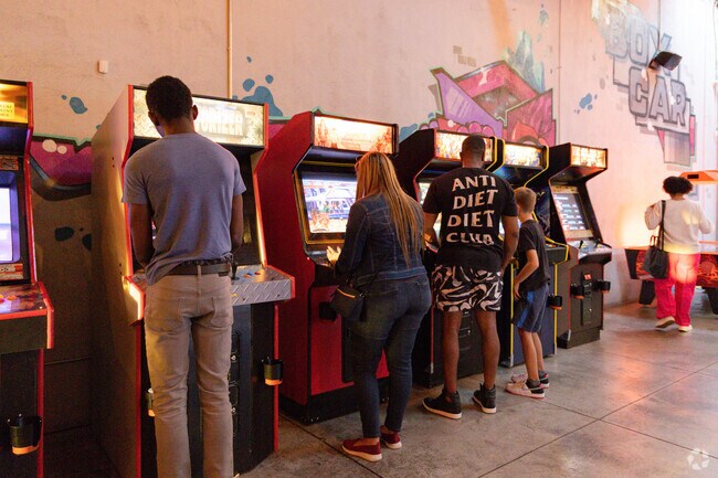 Enjoying games and good times at Boxcar Bar + Arcade in Benjamin Benson.