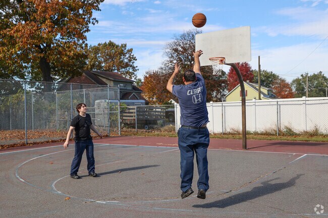 Residents enjoy playing basketball at Ray Ash Park in Aldenville.