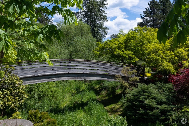 A wooden bridge leads into the Japanese Garden at Main City Park in Downtown Gresham.
