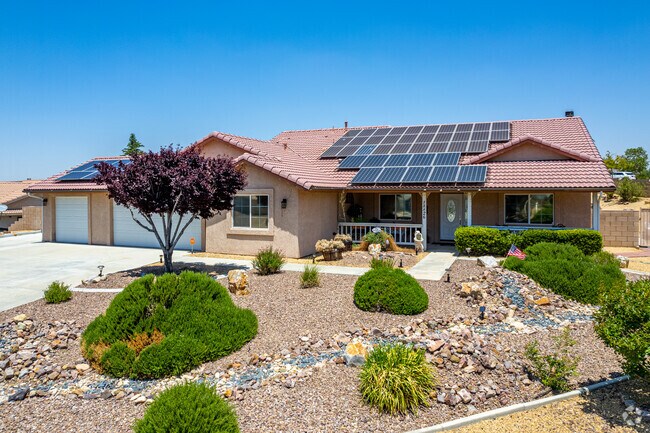 Here is a Spanish style home with solar panels in Apple Valley.
