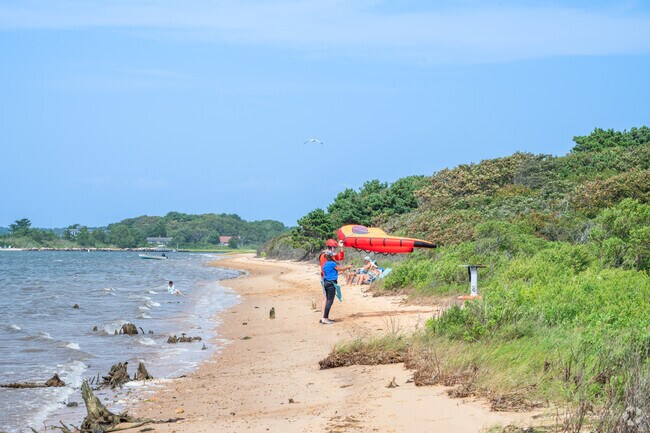 Waquoit kite surfers get read to hit the water at Callies Beach.