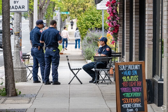 Local firefighters grab a drink of coffee at Lavender & Honey Espresso Bar in the Historical Highlands neighborhood of Pasadena.