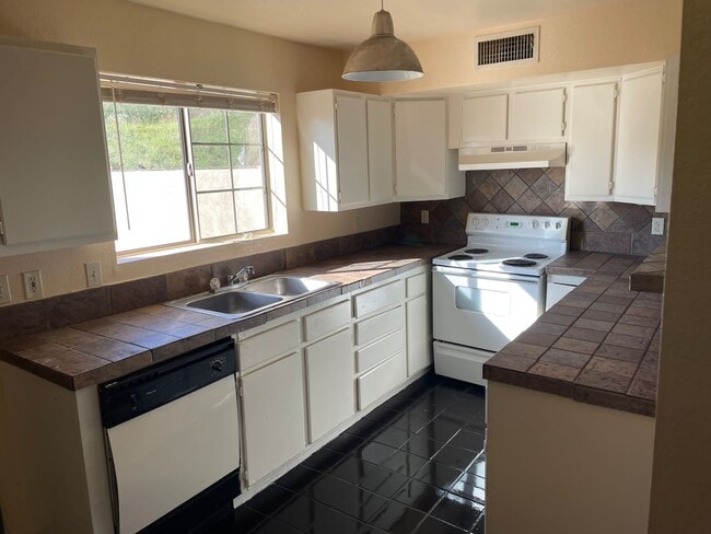 Large Open Kitchen with Tile Surround