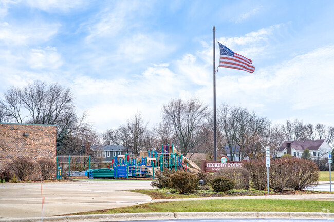 Hickory Point School has a large playground adjacent to the school building.