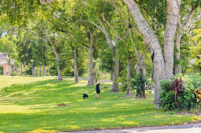 Active residents at The Woodlands enjoy walking their dogs on the closed golf course.