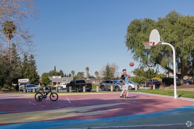 Bonding over hoops Son and father at Hillsdale Park, Meadowbrook.